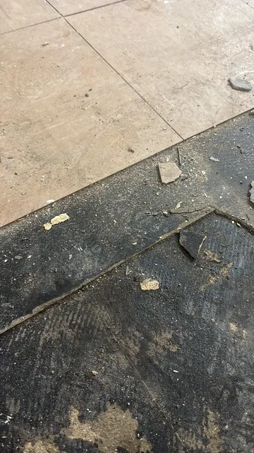Black bitumen mastic floor removal in a SE19 flat